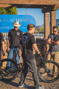 John Volken Academy students receiving newly donated bike from Action Rideshop 